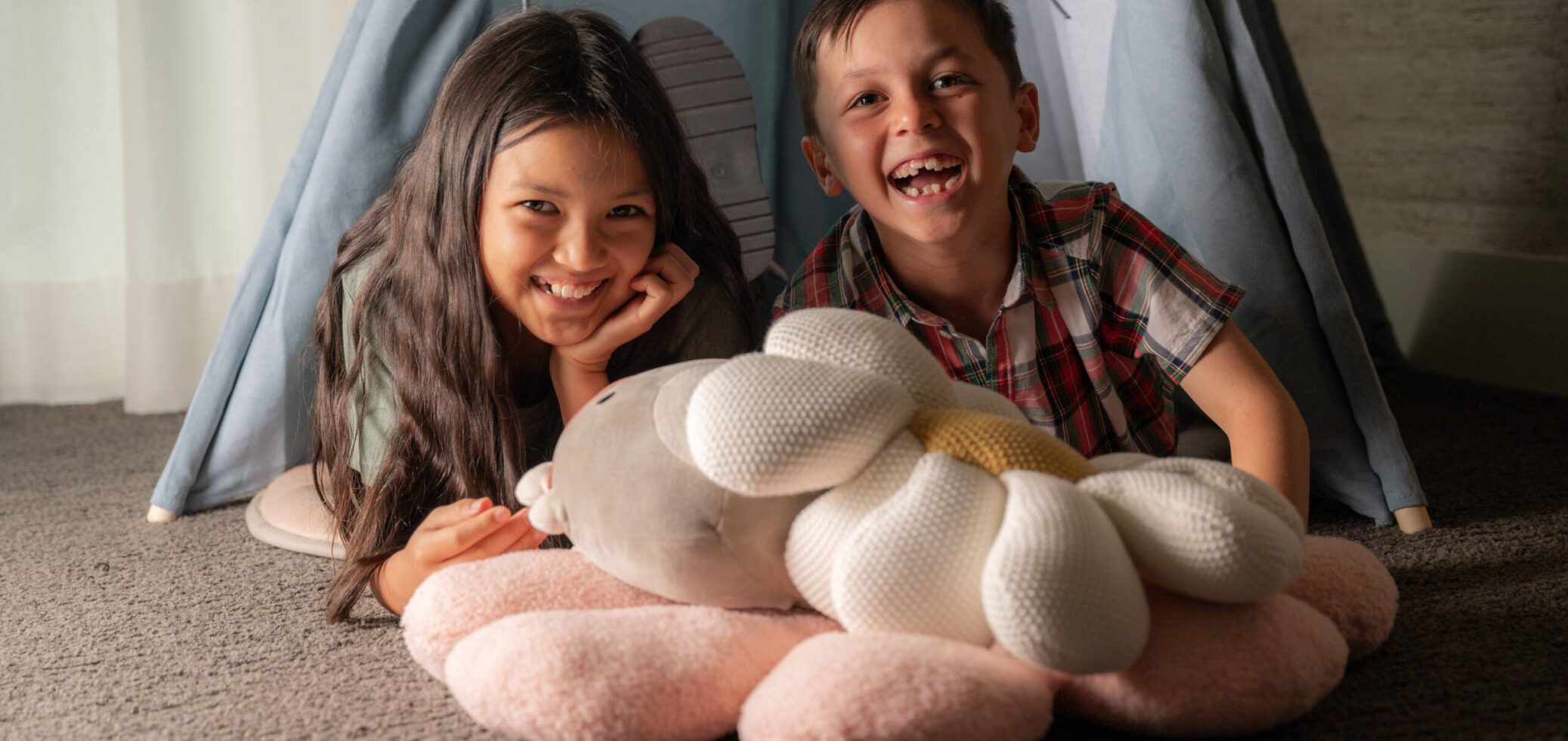 Two Children Smiling and Playing