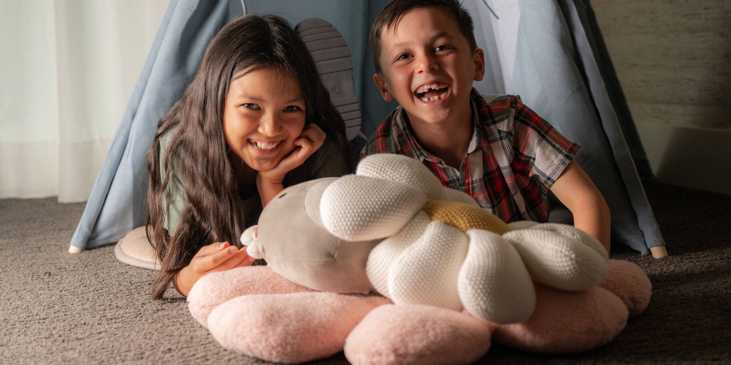 Two Children Smiling and Playing